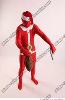 JOEL_ADAMSON CHRISTMAS VALLAIN WITH GUN AND BAG